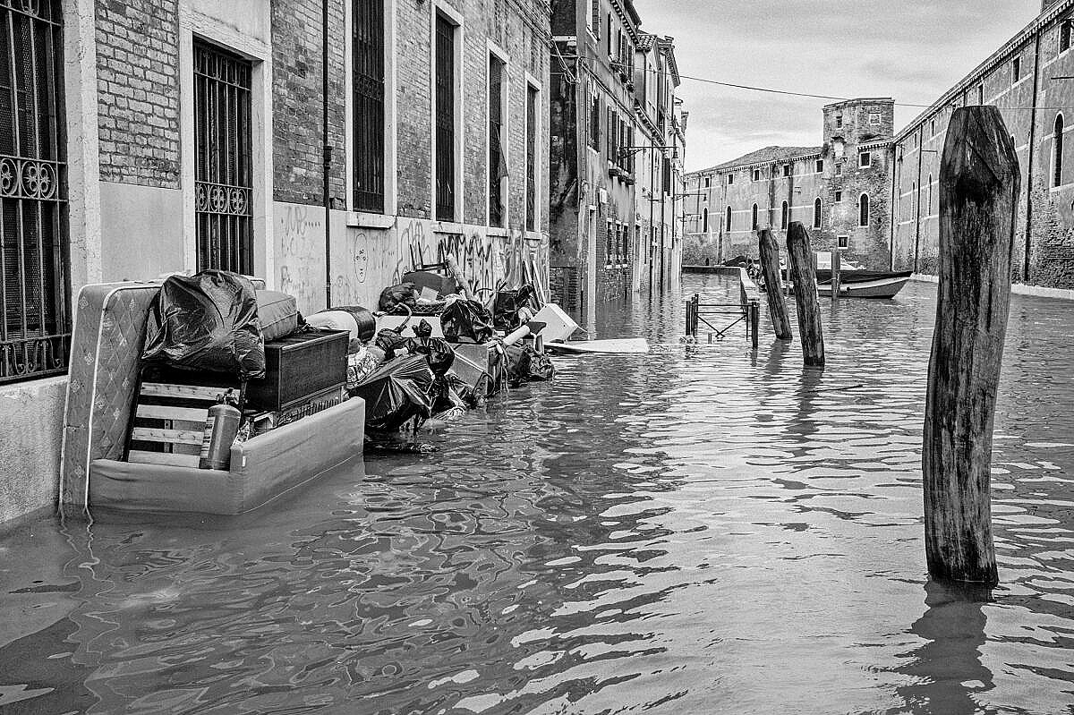High tide - Venice under water - Fondamenta de la Tana with debris piled up
